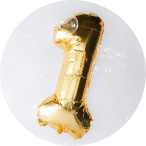 A balloon in the shape of a one.
